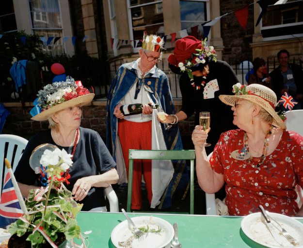 GB. England. Bristol. Neighbours from Goldney Avenue gather to celebrate the Queen's Golden Jubilee. The theme for the party is Kings and Queens. 2002.